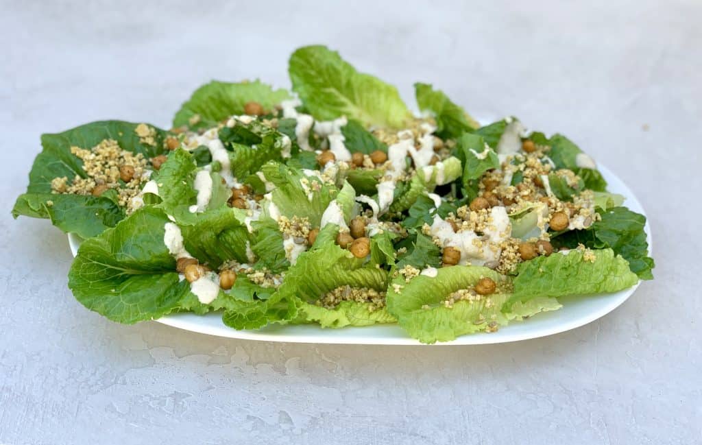 Side view of vegan caesar salad with roasted chickpea croutons