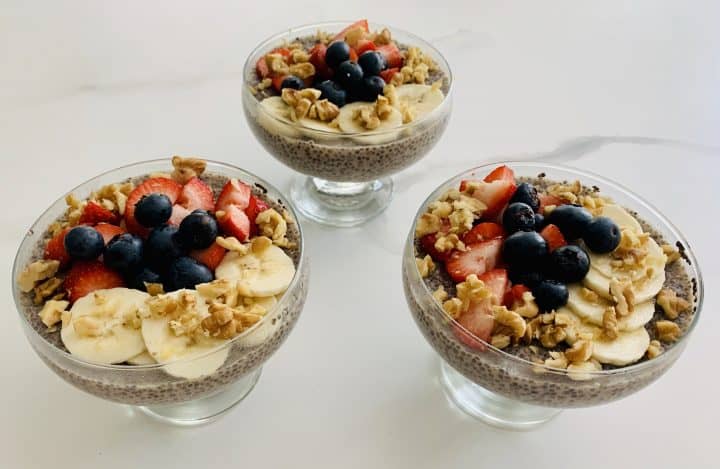 3 Lemon Chia Pudding with Berries, Bananas & Nuts in glass serving bowls