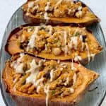 Close up image of Chickpea Stuffed Sweet Potato with Maple Tahini Drizzle
